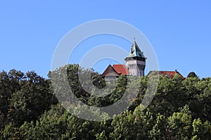 Romantic castle - fortress with tower in the forest. Smolenice castle, Congress Center of SAS - built in 15th century