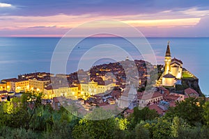 Romantic colorful sunset over picturesque old town Piran, Slovenia. photo