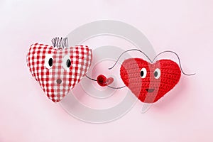 Romantic composition with fabric hearts on color background