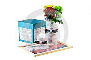 Romantic composition made of candle, flowers, songbook and box with a present photo