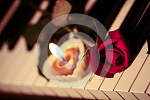 Romantic concept red rose on piano keys