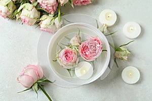 Romantic concept with roses on white textured table