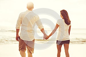 Romantic Couple on the Beach at Sunset.