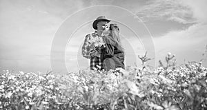 romantic couple among chamomile. love and romance. spring countryside.