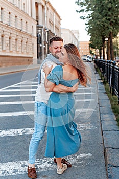 Romantic couple dancing in the street on a sunny summer day in city