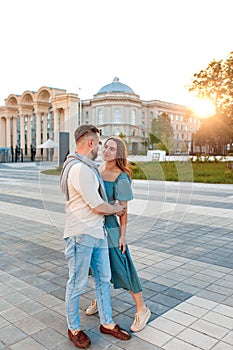 Romantic couple dancing in the street on sunset in city