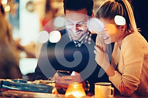 Romantic couple dating in pub at night