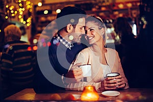 Romantic couple dating in pub at night