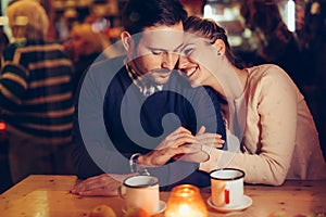 Romantic couple dating in pub at night