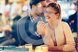 Romantic couple dating in pub at night