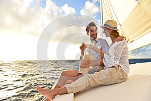 Romantic couple drinking champagne on sailing boat