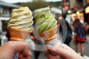 Romantic couple eat ice cream on holiday street