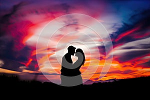 Romantic Couple Embracing In Front Of Vibrant Sunset Sealed With A Kiss
