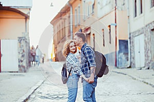 Romantic couple embracing on the street of old city