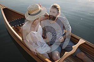 Romantic couple enjoy time outdoors in the canoe