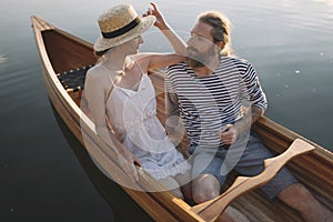 Romantic couple enjoy time outdoors in the canoe