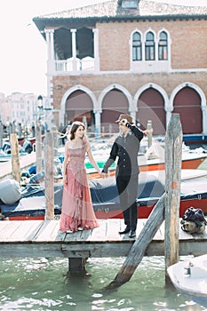 Romantic couple enjoying evening in Venice