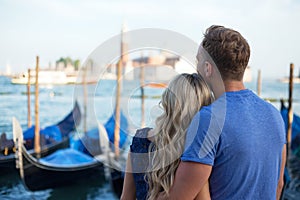Romantic couple enjoying evening in Venice photo
