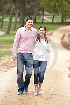 Romantic couple enjoying walk in park