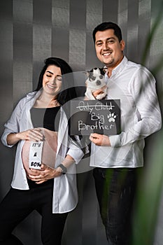 Creative couple with small dog expecting baby, Creative photoshoot for pregnancy, happy family waiting for baby boy