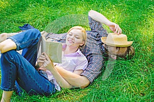 Romantic couple family enjoy leisure with poetry or literature grass background. Couple soulmates at romantic date
