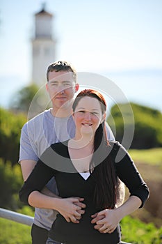 Romantic couple in front of a Lighthouse in California