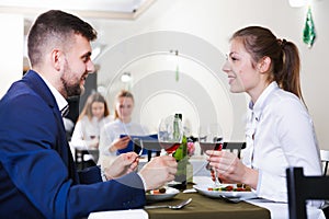 Romantic couple is having dinner in the restaurante