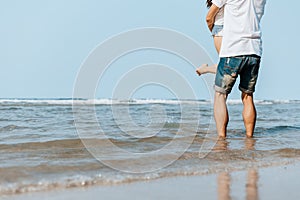 Romantic couple having love and hug on the beach