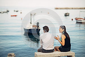 Romantic couple having relationship problems.Woman crying and begging a man.Fisherman life,dangerous occupation.Navy sailors