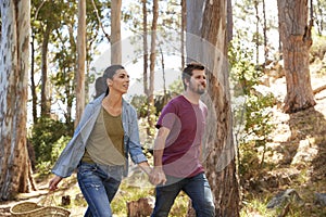 Romantic Couple Hiking Along Forest Path Together