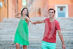 Romantic couple holding hands on Steps in Rome enjoy italian holidays. Happy lovers walking on the travel landmark