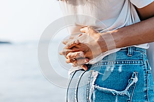 Romantic couple hug together on the beach at summer. Honeymoon, travel, holiday, summer concept