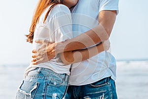 romantic couple hug together on the beach at summer. Honeymoon  travel  holiday  summer concept