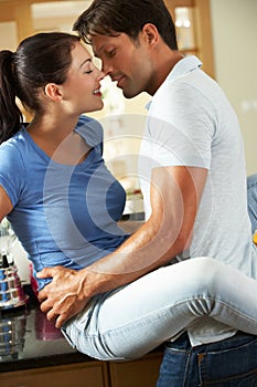 Romantic Couple Hugging In Kitchen