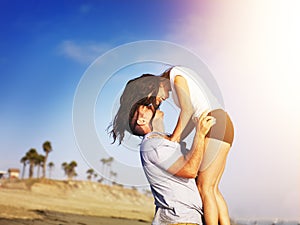 Romantic couple in intimate moment on the beach.