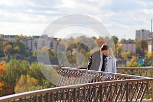 Romantic couple kissing in autumn park