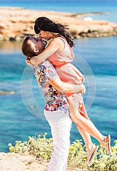 Romantic couple kissing on the beach