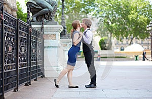Romantic couple kissing near Hotel de Ville