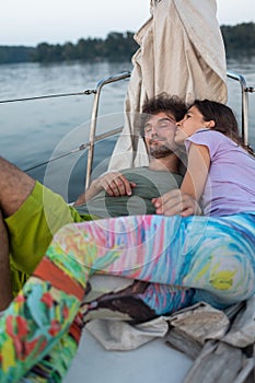 Romantic couple lies on a yacht