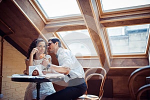 Romantic couple in love bonding in cafe