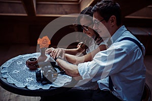 Romantic couple in love bonding in cafe