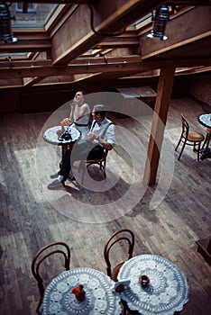 Romantic couple in love bonding in cafe