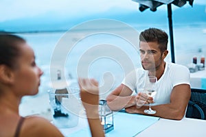Romantic Couple In Love Having Dinner At Sea Beach Restaurant