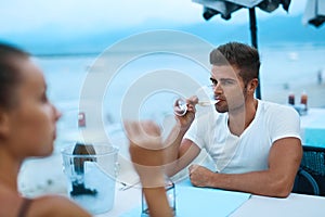 Romantic Couple In Love Having Dinner At Sea Beach Restaurant