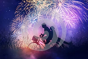Romantic couple in love with their bicycle and fireworks