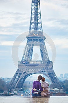 Romantic couple near the Eiffel tower in Paris, France