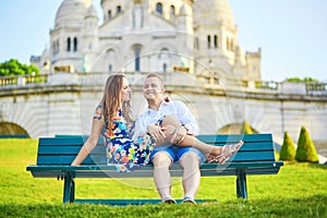 Romantic couple near Sacre-Coeur cathedral on Montmartre, Paris