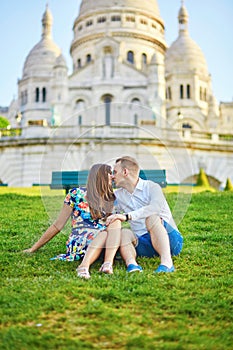 Romantic couple near Sacre-Coeur cathedral on Montmartre, Paris