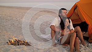 Romantic Couple Near a Tent on the Beach