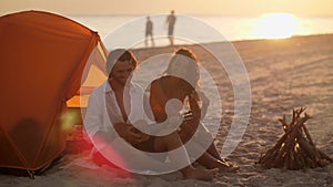 Romantic Couple Near a Tent on the Beach